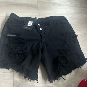 Fashion Nova Medium NWT ripped black out distressed denim shorts